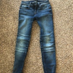 Buckle Black medium/dark denim jean, mid rise.